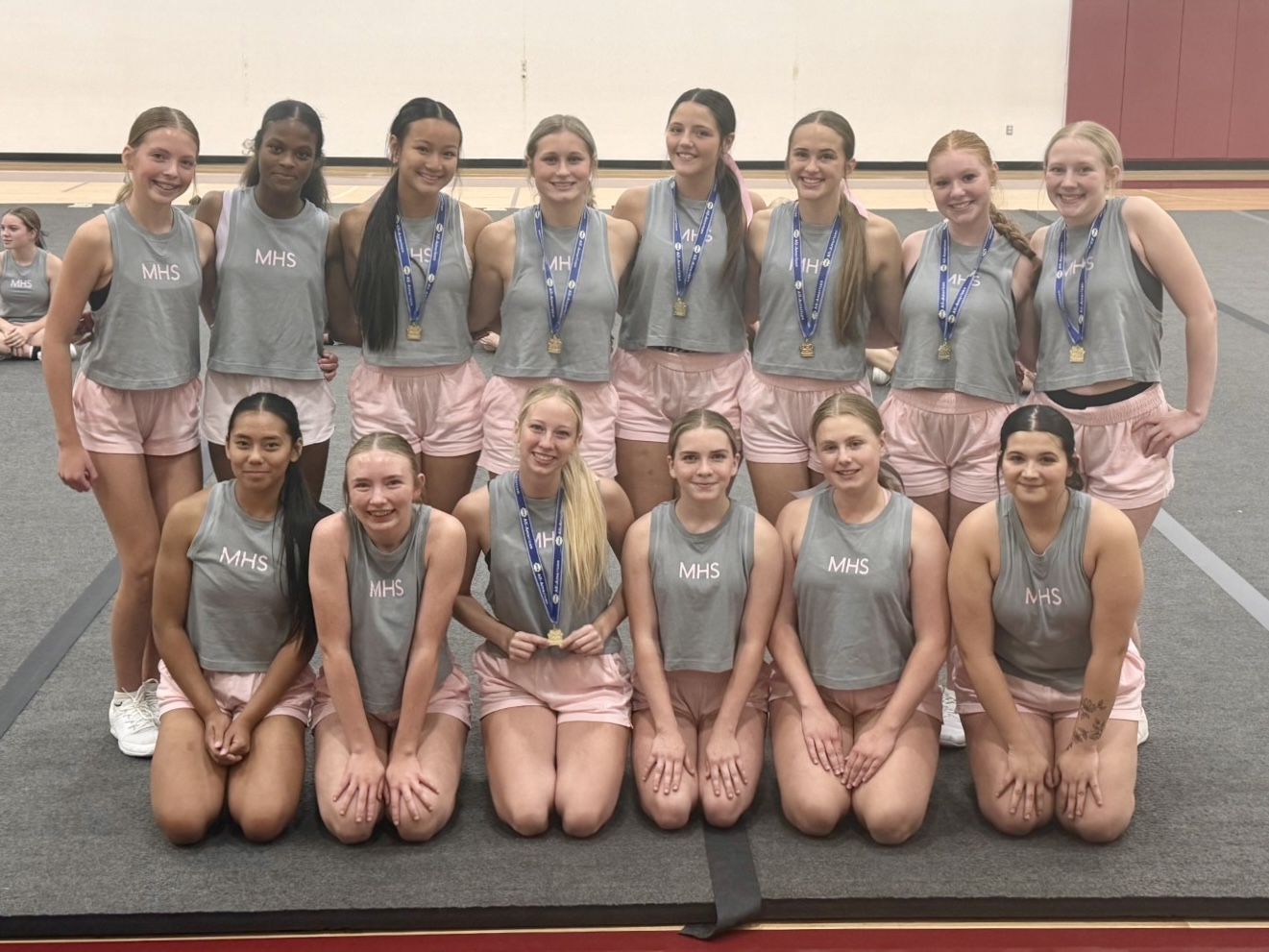 Minot High cheerleaders earn All American award at UCA camp